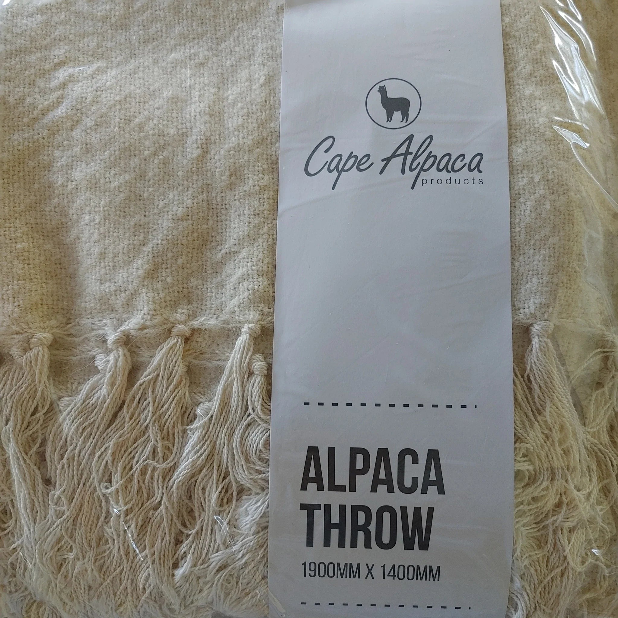 Cape Alpaca natural white silk throw in packaging, labelled Alpaca Throw 1900mm x 1400mm